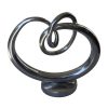 AR-036 Aluminium Sculptural Piece With Elliptical Form With Knot. One of Many Beautiful Accessories from Adesso Wholesale.